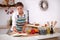 Young woman reading cookbook in the kitchen,