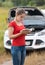 Young woman reading manual book for her broken car