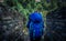 Young woman ready to cross suspension bridge in Annapurna Base Camp trekking in Nepal