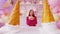 Young woman in red dress with donut, standing in decorative confectionery. Happy female in glasses holding sweet food