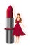 Young woman in red dress holding a gigantic lipstick
