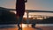 Young woman in a red dress on pier on Porto sunset background