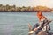 Young woman with red hair at the river