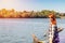 Young woman with red hair at the river