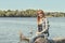 Young woman with red hair at the river