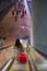 Young woman with a red suitcase on the escalator going down to the train platform at Atocha station, Madrid Spain