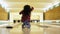 Young woman rejoices her failure during throwing bowling ball