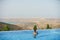 Young woman relaxaing in the swimming pool