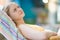 Young woman relaxin in chair in aqua park