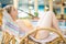 Young woman relaxin in chair in aqua park