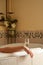 Young Woman Relaxing in the Bathroom Spa Tub with a Glass of Sparkling Champagne and Candles