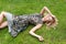 Young woman relaxing on a beautiful green meadow.