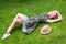 Young woman relaxing on a beautiful green meadow.