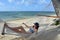 Young woman relaxing on a hammock on a tropical pacific island b