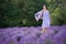 Young woman relaxing in lavender field