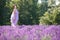 Young woman relaxing in lavender field