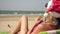 A young woman is relaxing on a tropical sea beach during Christmas or New Year