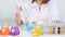 A young woman researcher, doctor, scientist, or laboratory assistant working with plastic medical tubes to research, examine