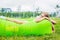 Young woman resting on an air sofa in the park.