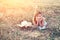 Young woman resting on the flower field. smiling woman port