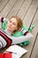 Young woman resting lying head on backpack