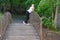 Young woman resting in the summer park in nature. pensive blonde outdoor girl