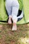 Young woman resting in a tent on the nature