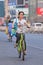 Young woman rides a public share bike, Beijing, China