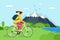 Young woman riding bicycle in mountains. Girl bicyclist tourist with backpack on bike travel in nature. Female cyclist