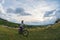 Young woman riding her bike on a rural trail