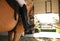 Young woman riding horse, closeup of leg in stirrup. Beautiful pet