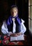 Young woman with Romanian traditional costume in Bucovina, Romania