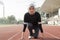 Young woman runner doing stretching exercise, preparing for morning workout