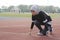 Young woman runner doing stretching exercise, preparing for morning workout