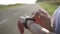 Young woman runner looking at sports smart watch, checking performance or heart rate pulse trace. Closeup of hands and