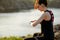 Young Woman Runner Using Multisport Smartwatch at Sunset Trail. Closeup of Hand with Fitness Tracker. Sports Concept