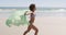 Young woman running at the beach 4k