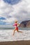 Young woman running on beach, summer inspiration