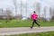 Young woman running on a cold winter day