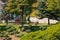 Young woman running in the park in a sunny morning while listening to the music with wireless earphones  in Dikmen Valley Park