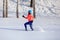 Young woman running in winter