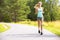 Young woman runs alone outdoor in the forest