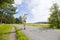 Young woman runs fast on a road in the forest