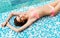 Young woman in s swimsuit. Girl relaxing in a pool