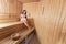 Young woman in sauna