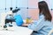 Young woman in a science lab. Health care researchers working in life science laboratory