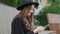 A young woman scrolls the page on a smartphone