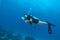 Young woman scuba diver showing ok sign