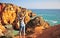 Young woman at sea cliffs, Lagos, Portugal