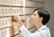 Young woman searches something in card catalog